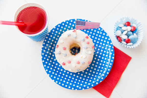 donut with juice and candies on independence day Stock photo © dolgachov