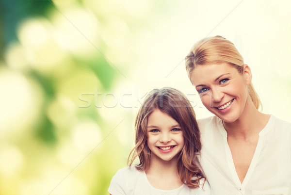 smiling mother and little girl Stock photo © dolgachov