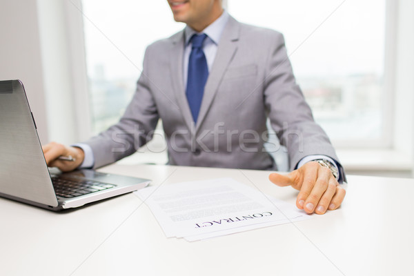 close up of businessman with laptop and papers Stock photo © dolgachov