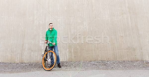 Heureux jeunes homme fixé engins [[stock_photo]] © dolgachov