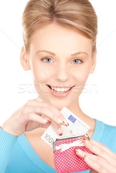 lovely woman with purse and money Stock photo © dolgachov