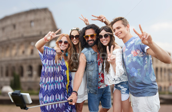 Stock photo: hippie friends with smartphone selfie stick