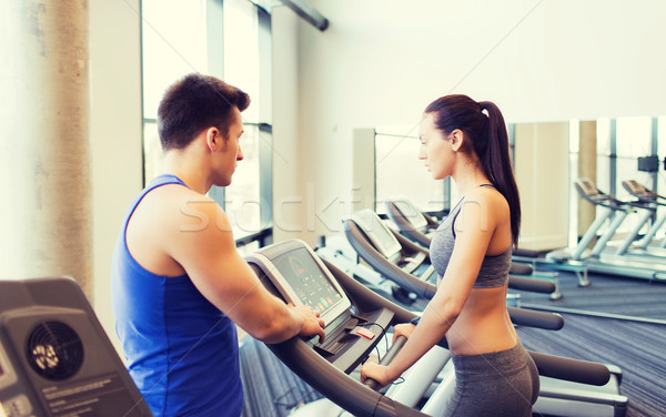 woman with trainer on treadmill in gym Stock photo © dolgachov