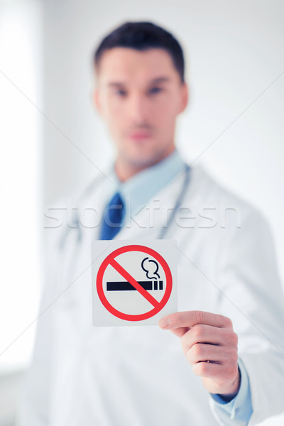 male doctor holding no smoking sign Stock photo © dolgachov