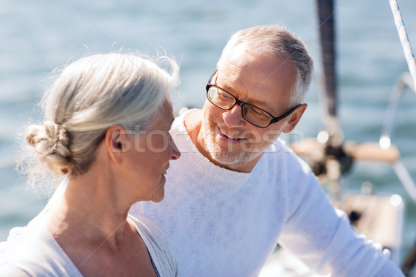 senior couple hugging on sail boat or yacht in sea Stock photo © dolgachov