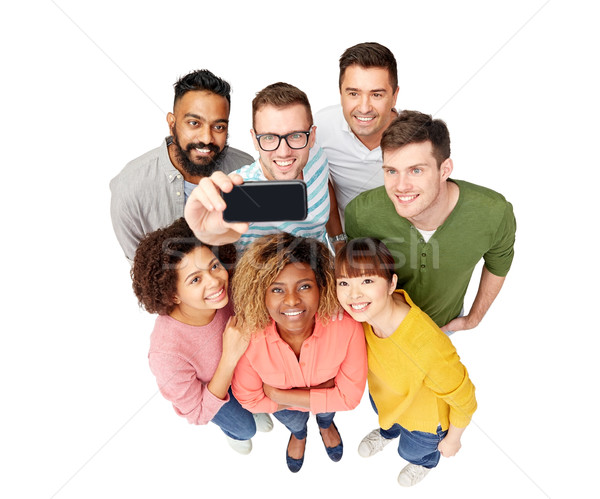 group of people taking selfie by smartphone Stock photo © dolgachov