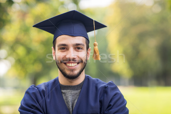 close up of student or bachelor in mortar board Stock photo © dolgachov