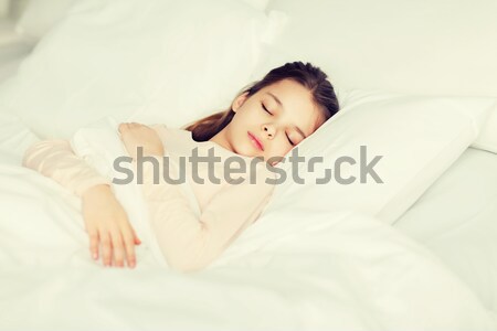 girl sleeping in bed at home Stock photo © dolgachov