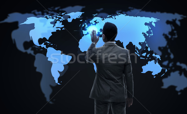 businessman working with virtual world map Stock photo © dolgachov