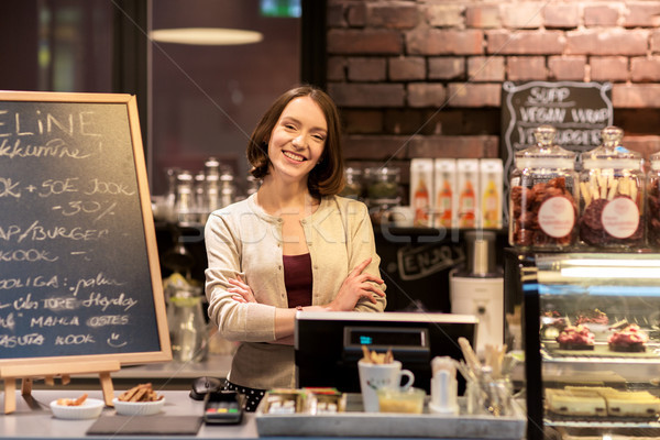 happy woman or barmaid at cafe counter Stock photo © dolgachov