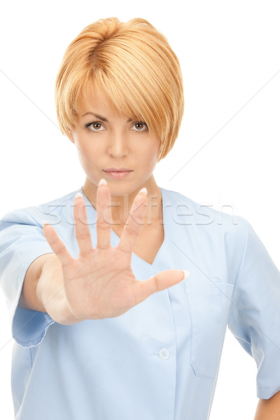 Stock photo: attractive female doctor showing stop gesture
