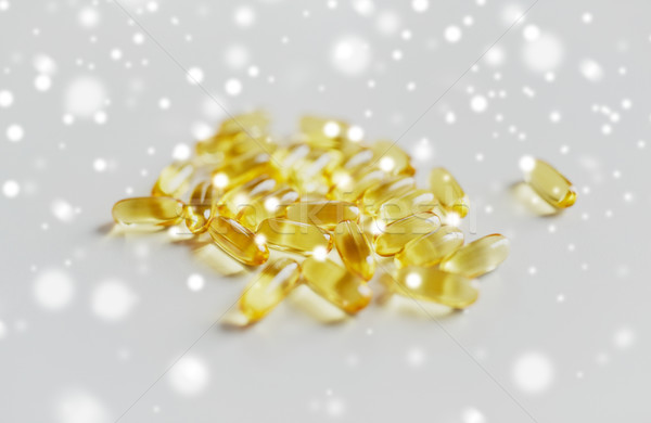 Stock photo: medicine or cod liver oil capsules