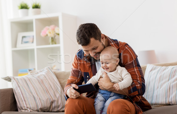 Père bébé garçon smartphone maison famille [[stock_photo]] © dolgachov