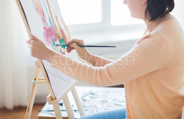 artist with brush painting still life at studio Stock photo © dolgachov