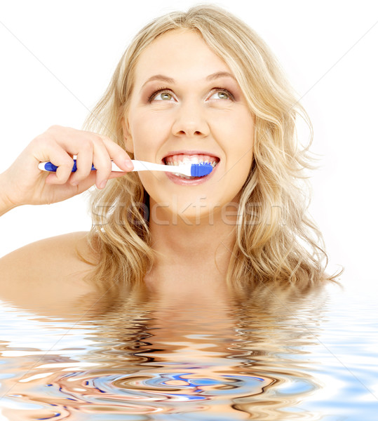 happy blond with toothbrush in water Stock photo © dolgachov