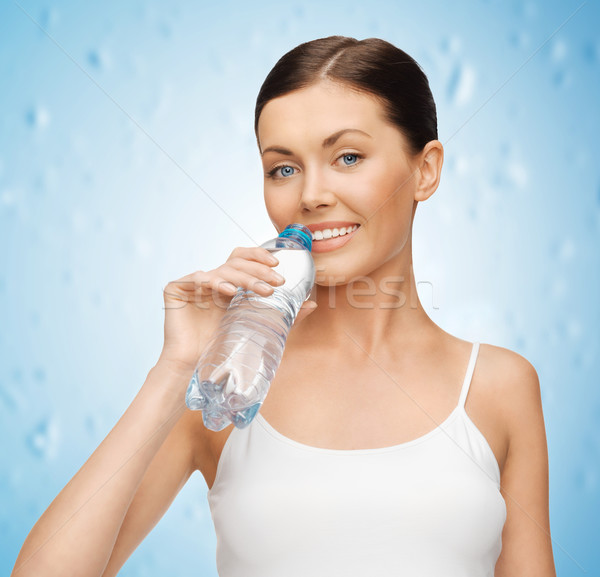 woman with bottle of water Stock photo © dolgachov