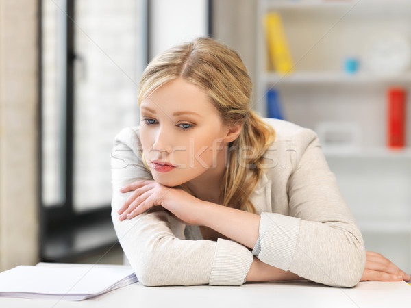 bored and tired woman behind the table Stock photo © dolgachov
