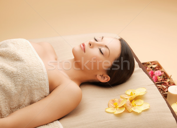 Stock photo: woman in spa salon lying on the massage desk