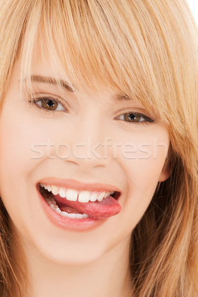 teenage girl sticking out her tongue Stock photo © dolgachov
