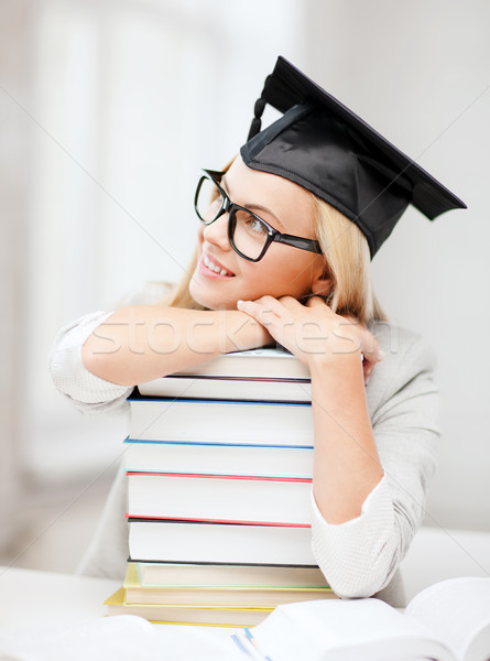 student in graduation cap Stock photo © dolgachov