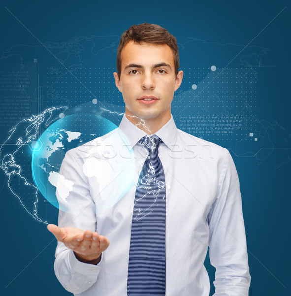 Homem virtual esfera globo palma Foto stock © dolgachov