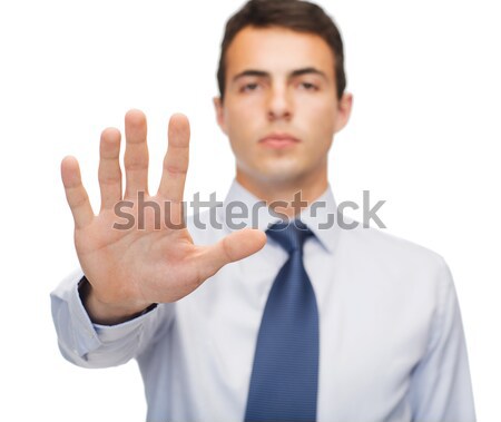 attractive buisnessman making stop gesture Stock photo © dolgachov