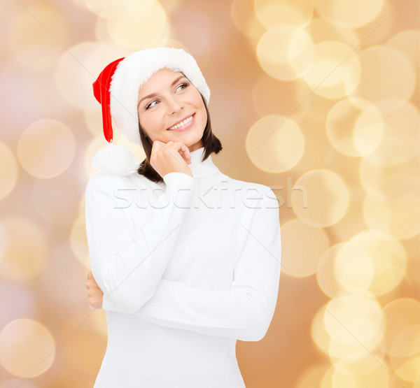 Düşünme gülümseyen kadın yardımcı şapka Noel Stok fotoğraf © dolgachov