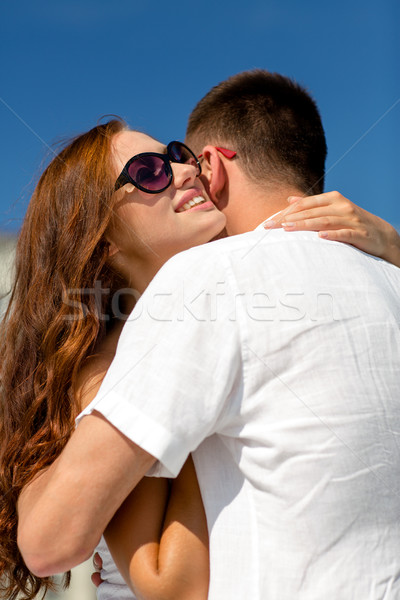 smiling couple in city Stock photo © dolgachov