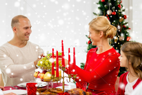 smiling family having holiday dinner at home Stock photo © dolgachov