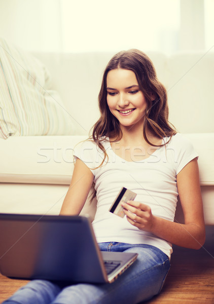 smiling teenage girl with laptop and credit card Stock photo © dolgachov