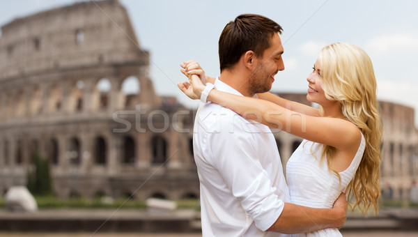 happy couple hugging over coliseum Stock photo © dolgachov