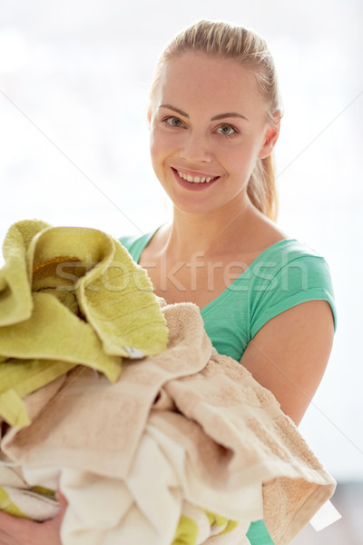快樂 女子 衣服 洗衣店 家 商業照片 © dolgachov