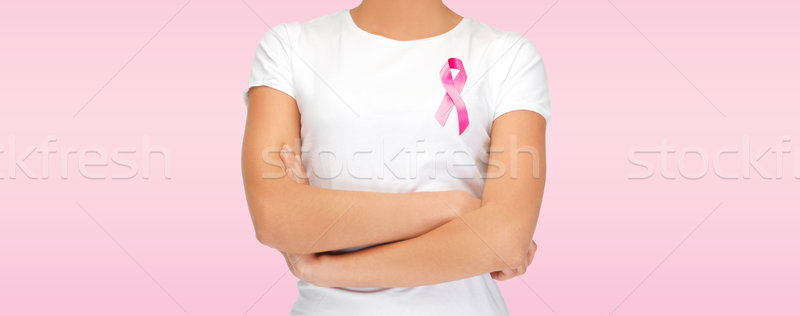 smiling woman with pink cancer awareness ribbon Stock photo © dolgachov