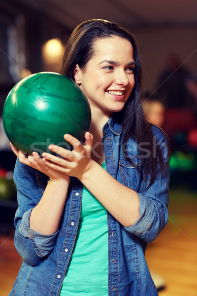 Heureux jeune femme balle bowling club [[stock_photo]] © dolgachov