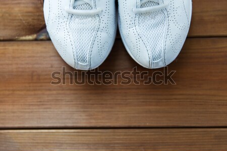 Közelkép sportcipők fapadló sport fitnessz cipők Stock fotó © dolgachov
