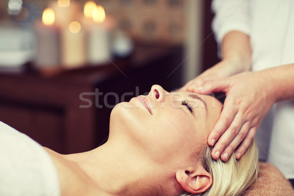 close up of woman having face massage in spa Stock photo © dolgachov