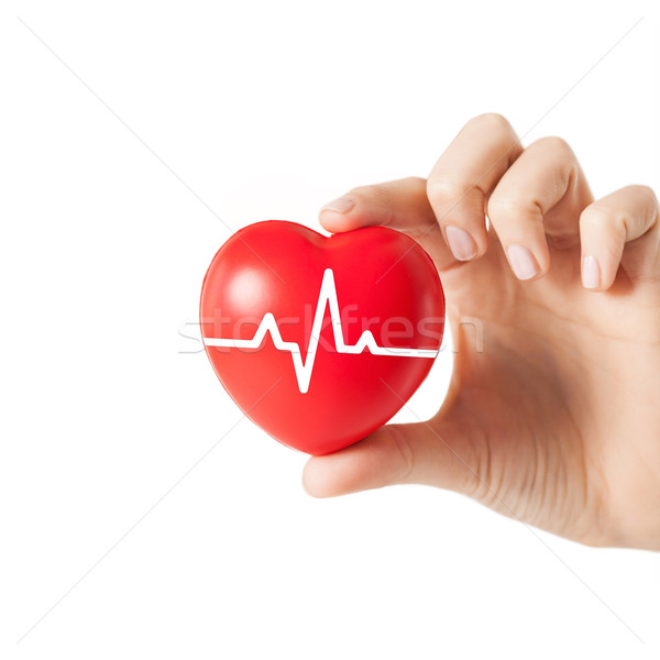 close up of hand with cardiogram on red heart Stock photo © dolgachov