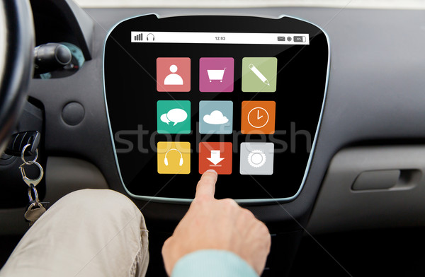 close up of hand and menu icons on car computer Stock photo © dolgachov