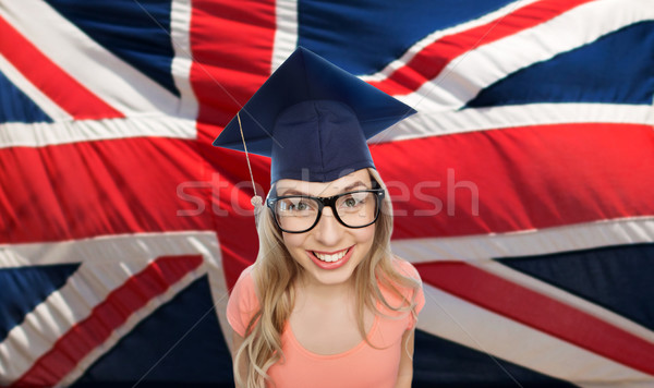 student woman in mortarboard over english flag Stock photo © dolgachov