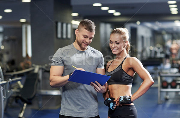 Sorridere personal trainer palestra fitness sport Foto d'archivio © dolgachov