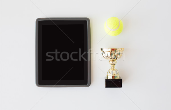 close up of tennis ball, cup and tablet pc Stock photo © dolgachov