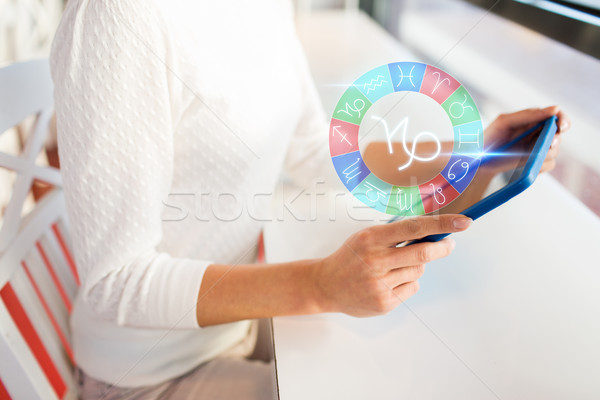 woman with tablet pc and zodiac signs at cafe Stock photo © dolgachov