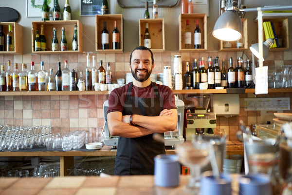 happy man, barman or waiter at bar Stock photo © dolgachov