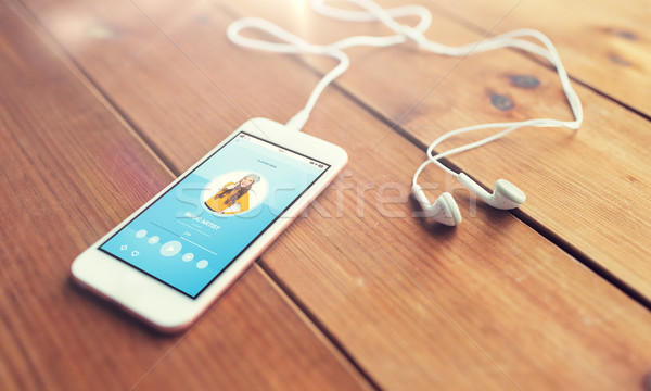 Közelkép okostelefon fülhallgató fa technológia zene Stock fotó © dolgachov