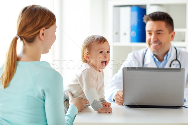 woman with baby and doctor with laptop at clinic Stock photo © dolgachov