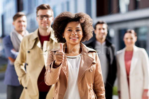 international business team showing thumbs up Stock photo © dolgachov