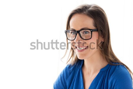 close up of smiling middle aged woman in glasses Stock photo © dolgachov