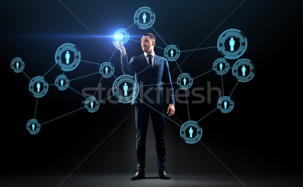 businessman with virtual network contacts Stock photo © dolgachov