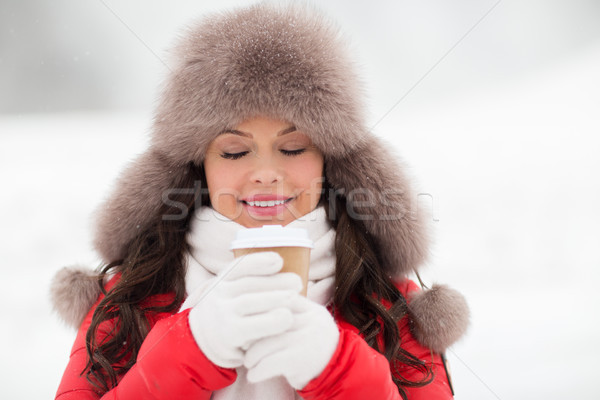 happy woman in winter fur hat with coffee outdoors Stock photo © dolgachov