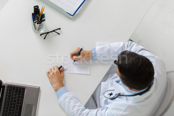 doctor hands with prescription at clinic Stock photo © dolgachov